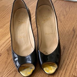 Patent black leather with gold tipped stilletto heel Christian Louboutin